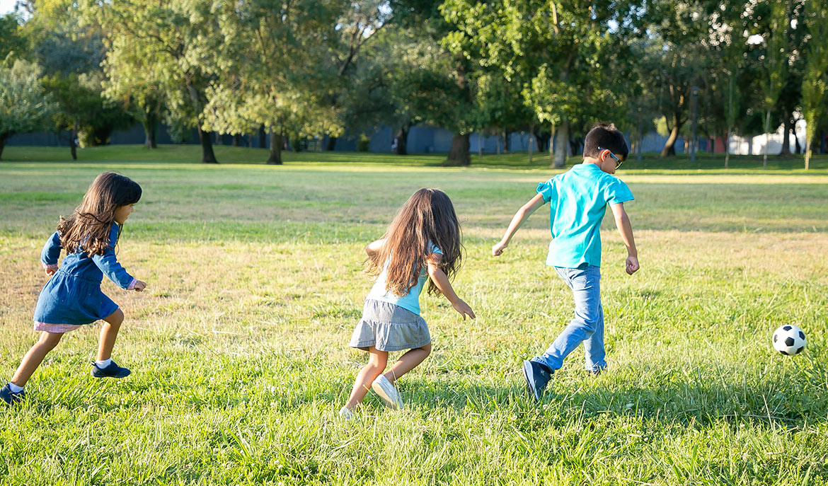 Children playing in the grass: 5 Techniques that help reinforce ABA Therapy Techniques: A blog from Positive Behavior Services
